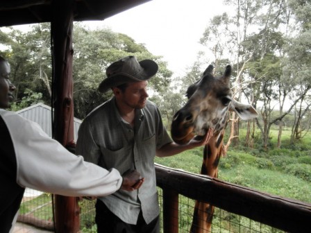 Events and Adventures Members Feeding Girafes in Kenya