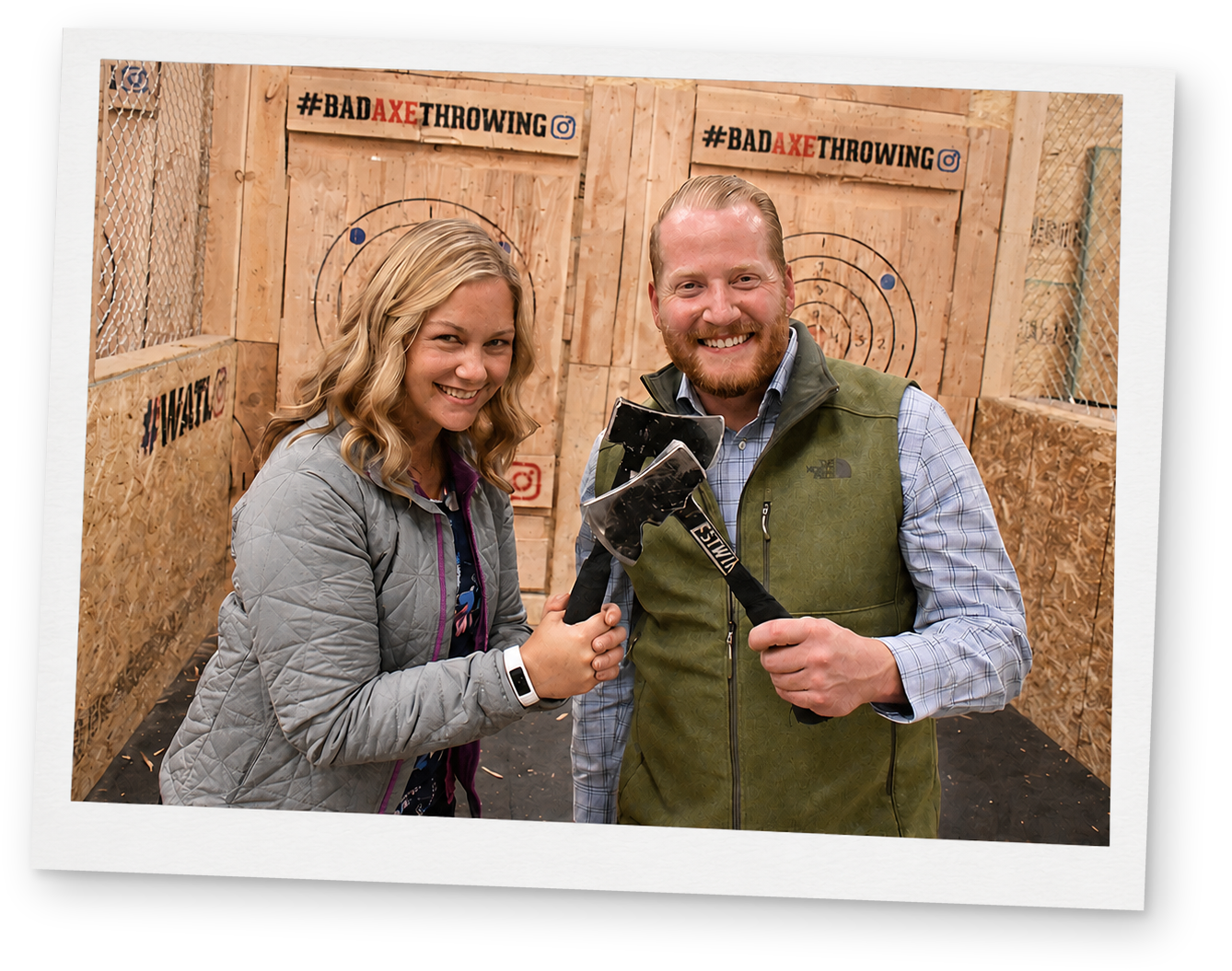 A member taking aim at the target during an axe throwing event.